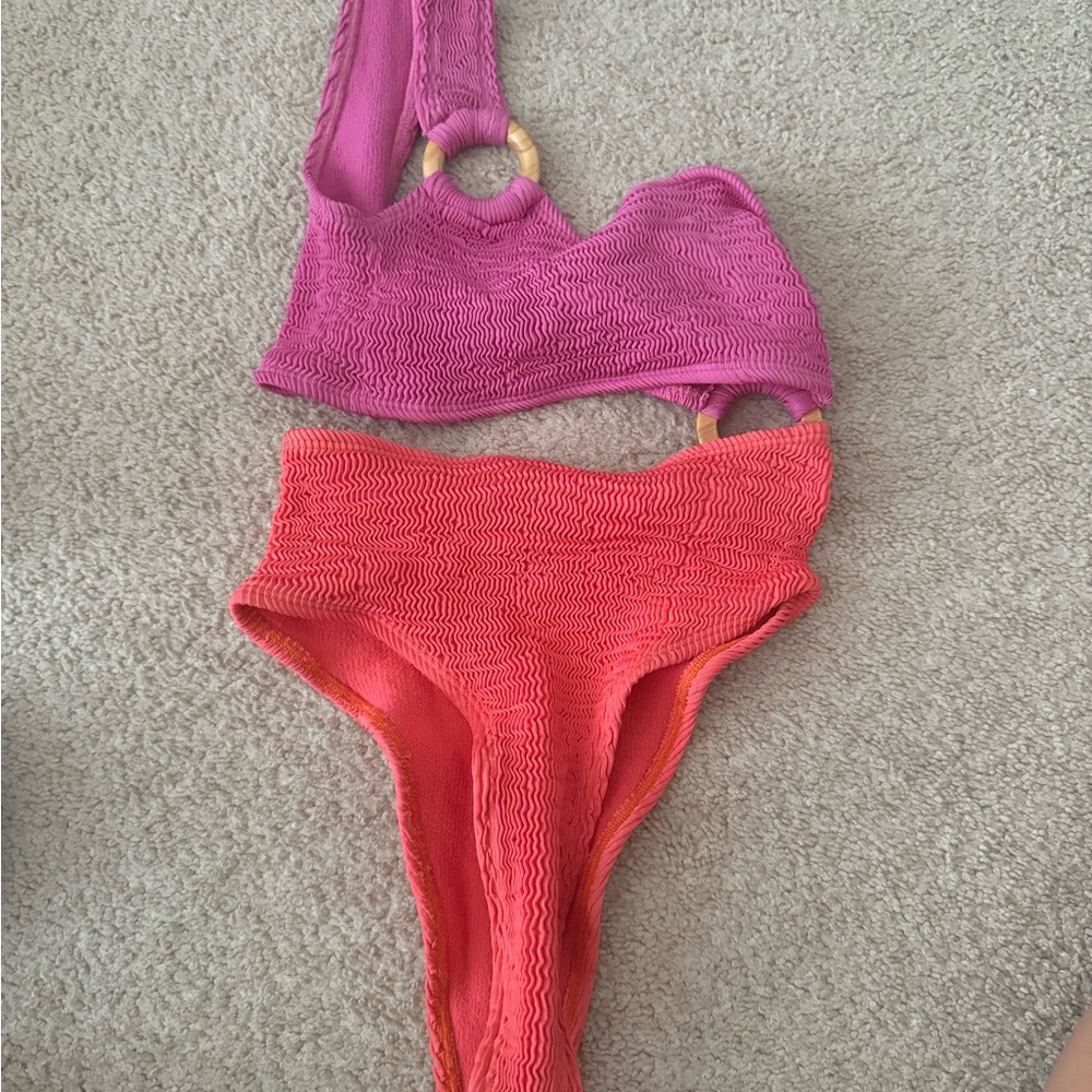 Worn a couple times but brand new condition. Cleonie cutout bikini one piece